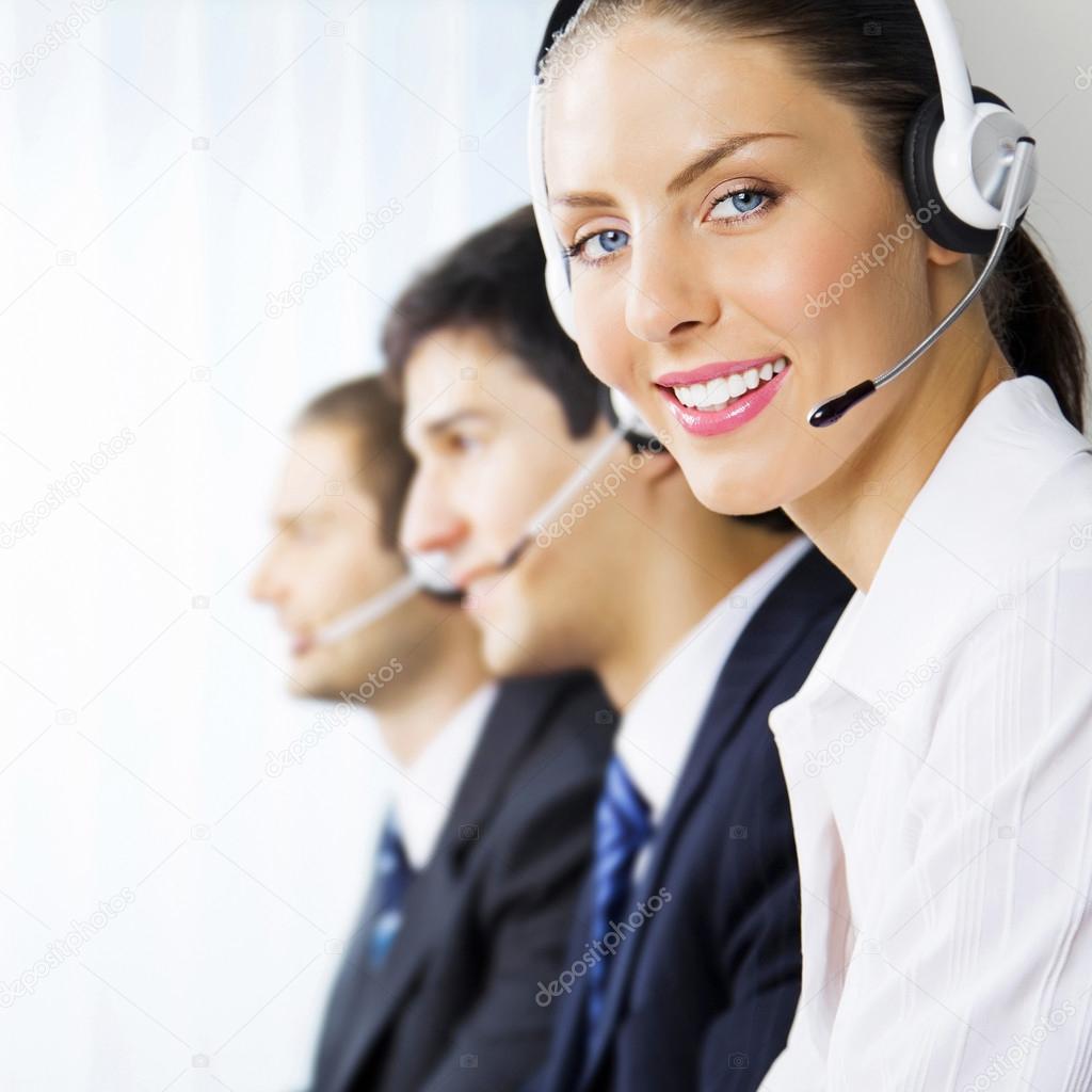 Three support phone operators at workplace