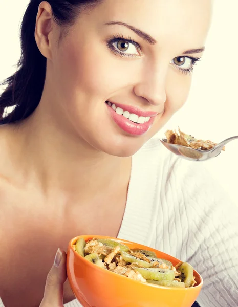 Woman eating muesli or cornflakes — Stock Photo, Image