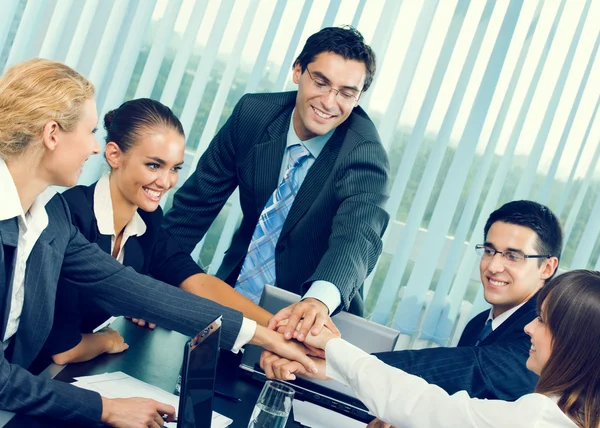 Happy successful gesturing business team at office Stock Picture
