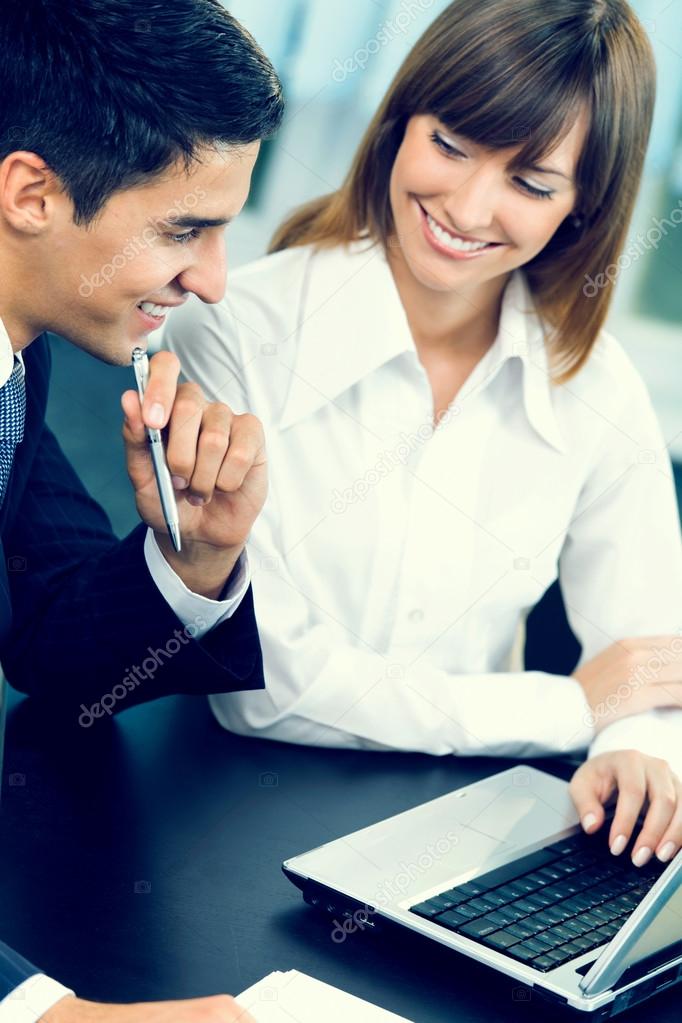 Two businesspeople working together at office