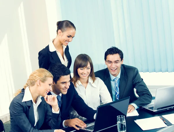 Successful business team working together at office Stock Picture