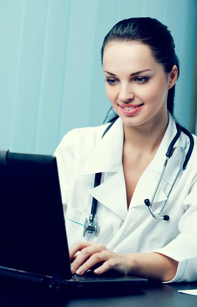 Portrait of happy successful doctor at office — Stock Photo, Image