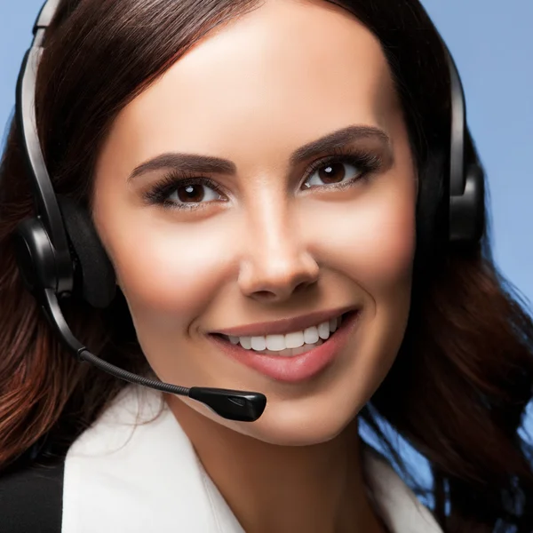 Customer support phone operator in headset, over blue — Stock Photo, Image