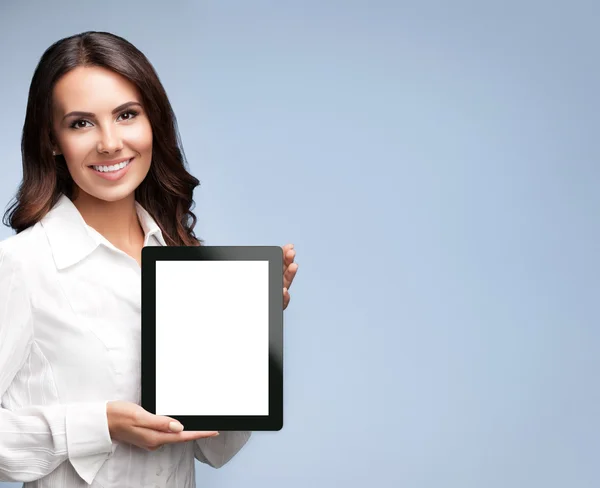 Business woman showing blank tablet pc, on grey — Stock Photo, Image