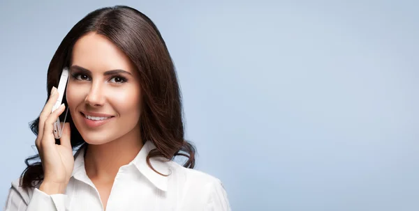 Cheerful customer support female phone operator with cell phone, — Stock Photo, Image