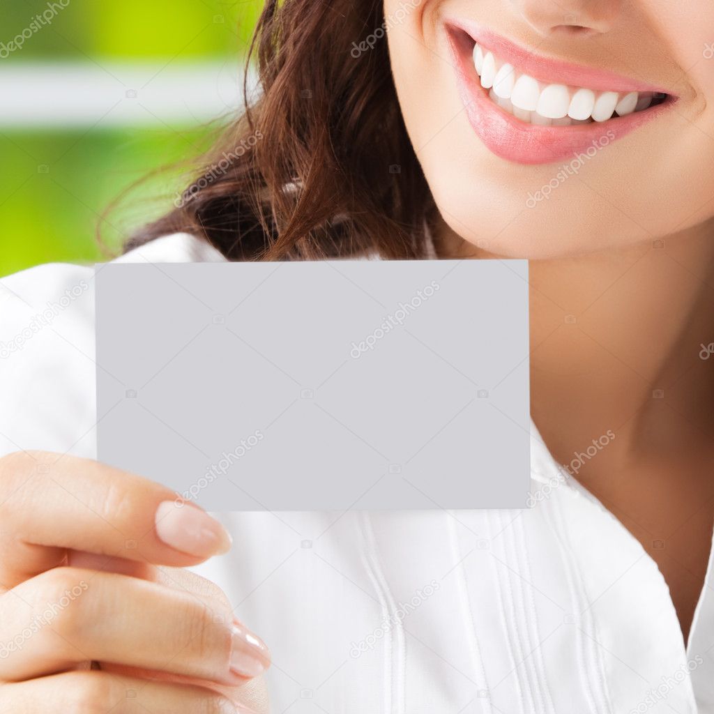  businesswoman showing blank business or plastic card
