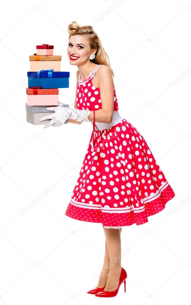 Full body of woman in pin-up style red dress with gift boxes, is