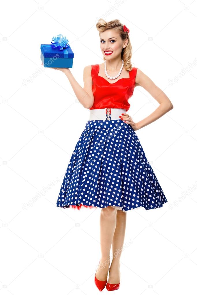 Full body of woman in pin-up style dress with gift box, isolated