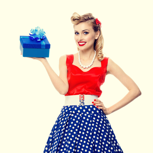 woman in pin-up style dress with gift box