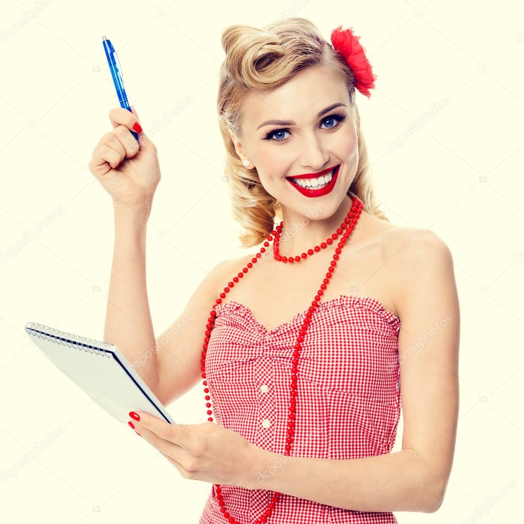 smiling woman with notepad, in pin-up style clothing