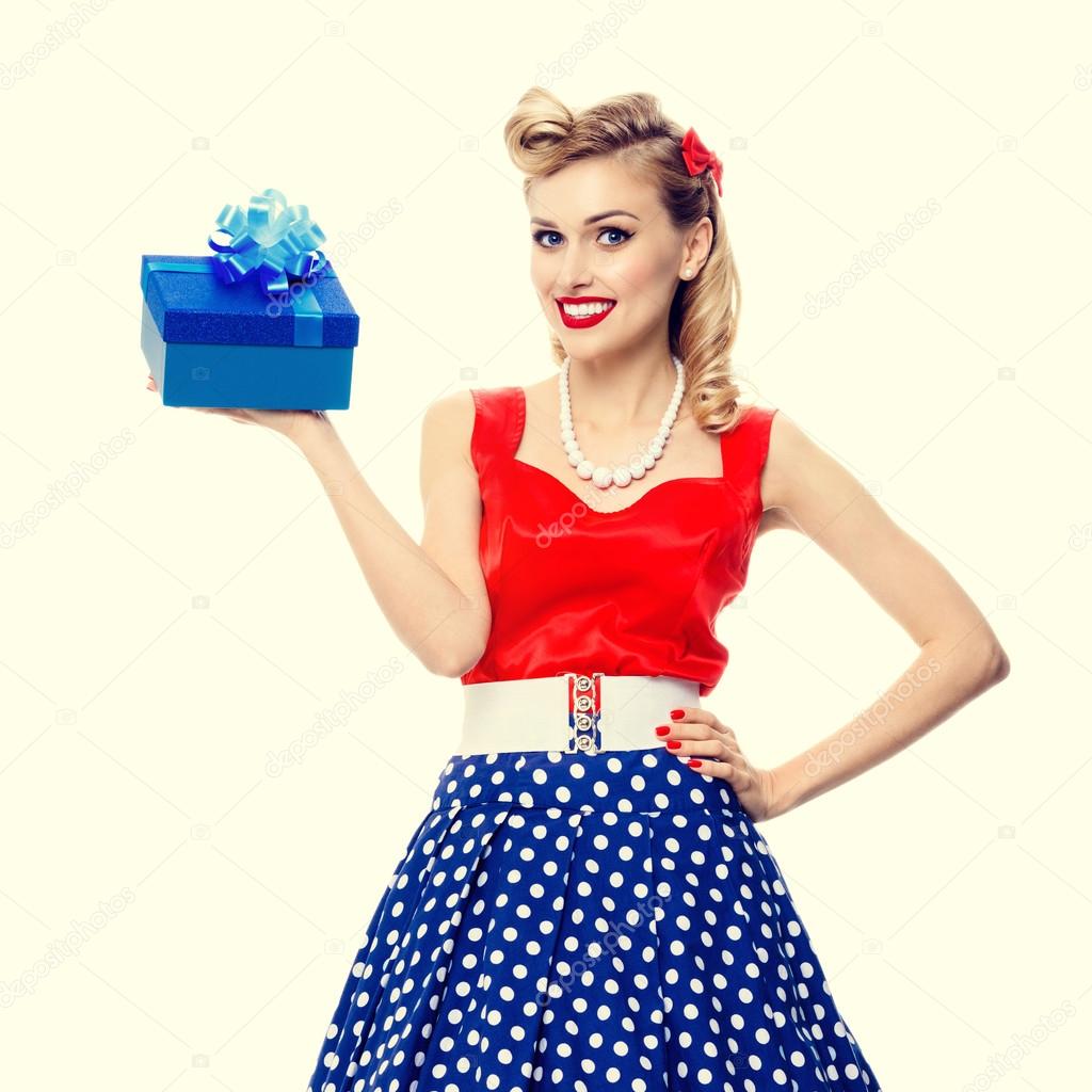 woman in pin-up style dress with gift box