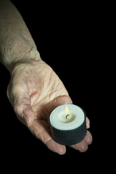 Hand and candle — Stock Photo, Image