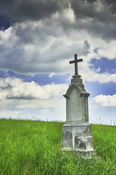 Wayside cross with grass — Stock Photo, Image