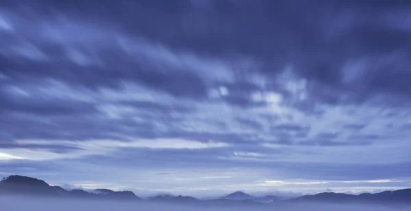 Hilly landscape with fog — Stock Photo, Image