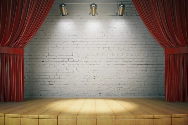 Wooden stage with red curtains and a white brick wall with spotl — Stock Photo, Image