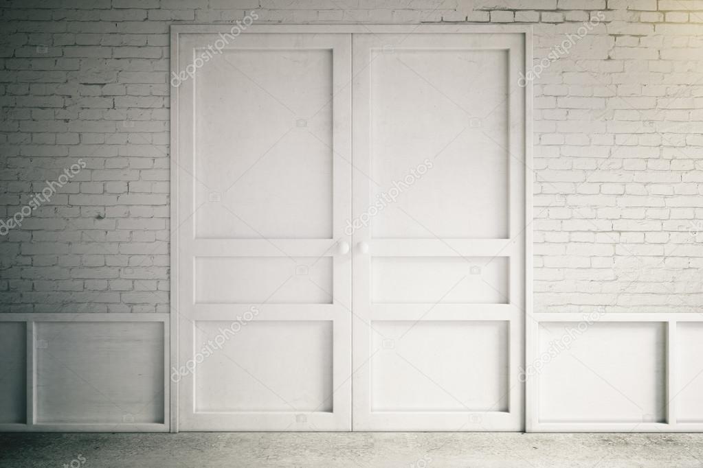 Empty interior with white doors and brick wall, 3d render