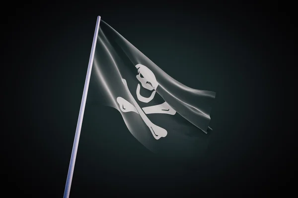 Піратський прапор на чорному фоні — стокове фото