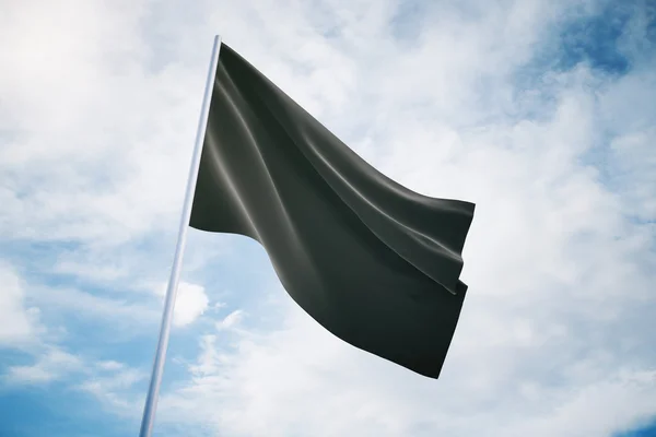 Черный флаг на фоне неба — стоковое фото