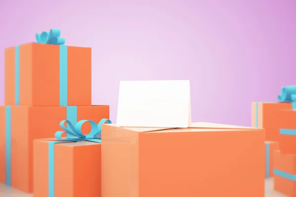 Leere Karte auf orangefarbenen Geschenken — Stockfoto