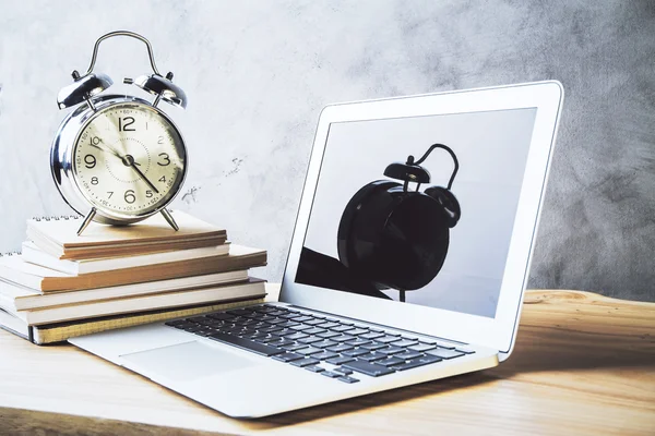 Laptop, alarm and books — Stock Photo, Image
