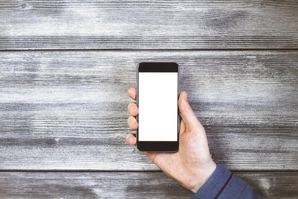 Phone on antique wood — Stock Photo, Image