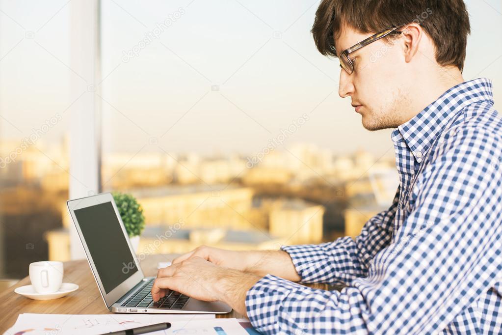 Man typing on keyboard side