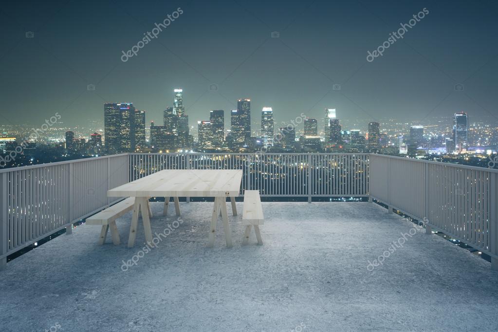Concrete balcony night city view Stock Photo by ©peshkova 107441734