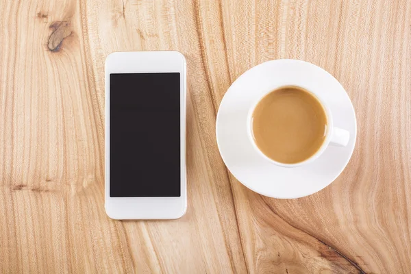 Caffè e telefono sul tavolo — Foto Stock