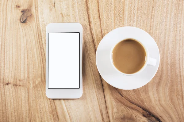 コーヒーとテーブルの上の携帯電話 — ストック写真