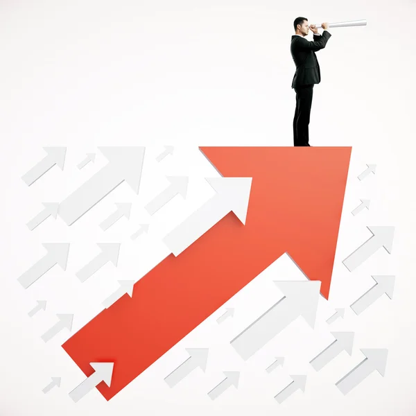 Success concept businessman on arrow — Stock Photo, Image