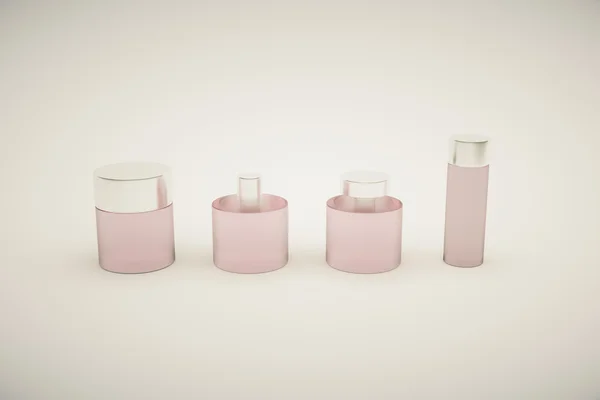 Pink bottles grey background — Stock Photo, Image