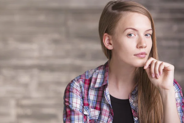 Female with hand at chin — Stock Photo, Image