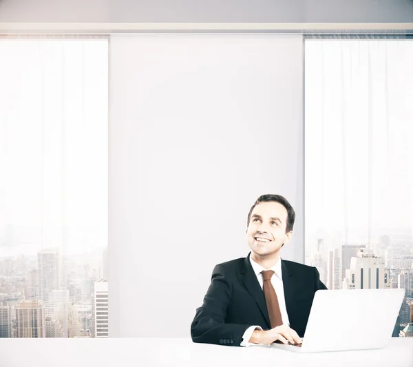 Thoughtful smiling businessman — Stock Photo, Image