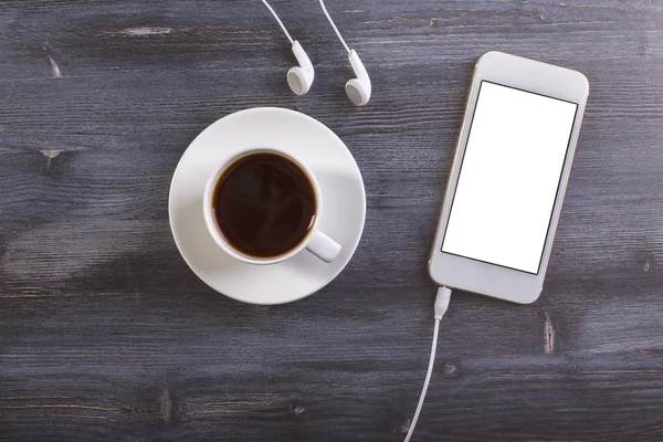 Kaffee und weißes Telefon oben — Stockfoto