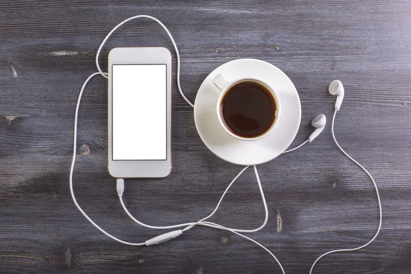 Koffie en mobiele telefoon terug naar boven — Stockfoto