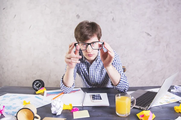 Businessman looking through eyeglasses — Stock Photo, Image