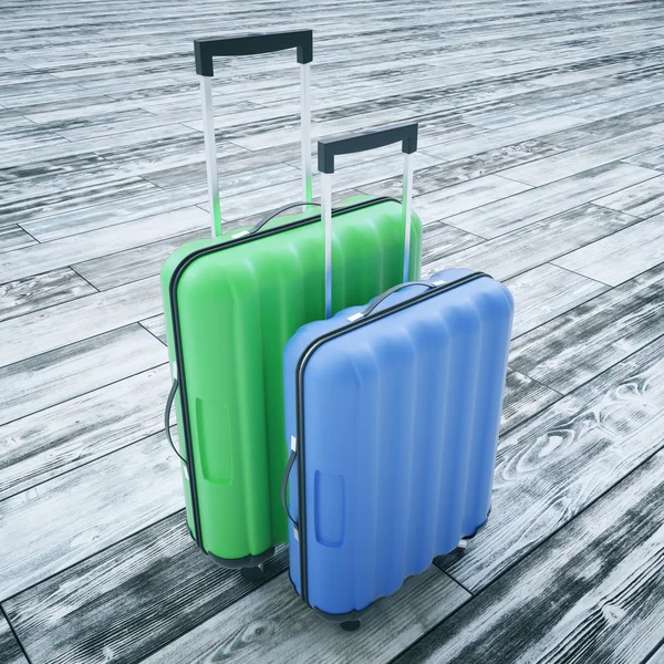 Suitcases on wooden background — Stock Photo, Image