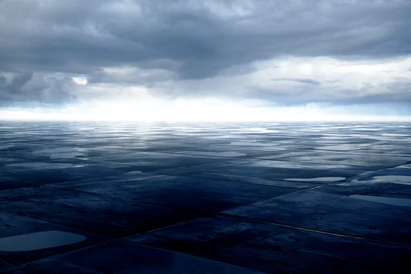 Blue ground with puddles — Stock Photo, Image