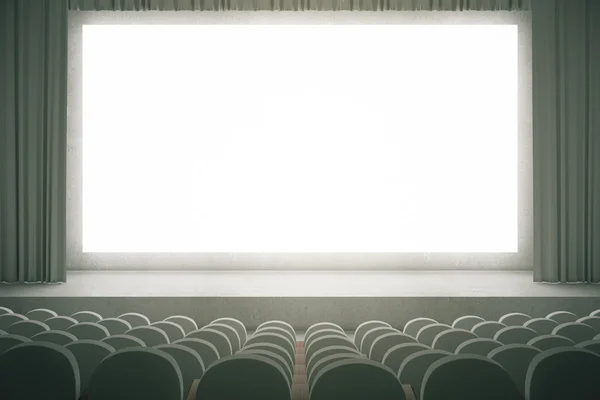 Grey cinema with blank screen — Stock Photo, Image