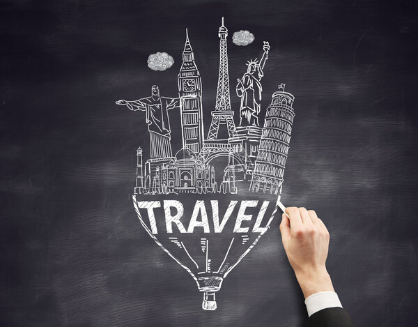 Travel concept with businessman hand drawing sketch on chalkboard background
