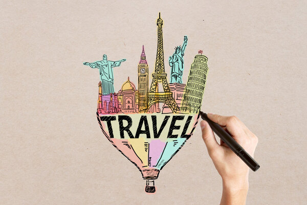 Travel concept with man's hand drawing sketch on light textured background