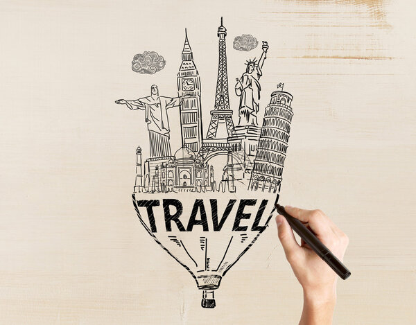 Travel concept with male hand drawing sketch on light textured background