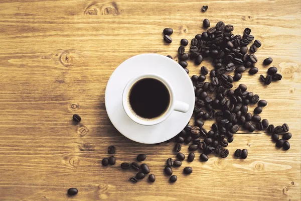 Koffiekopje en bonen — Stockfoto
