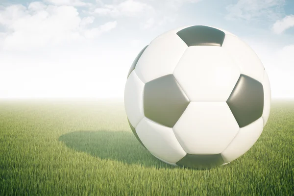 Closeup de futebol em grama verde e fundo do céu. Renderização 3D — Fotografia de Stock
