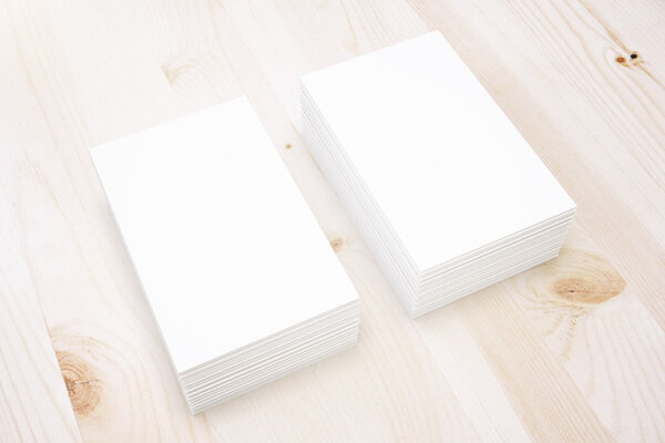 Business cards on light wood