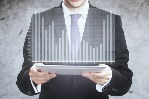 Businessman holding tablet with diagram — Stock Photo, Image