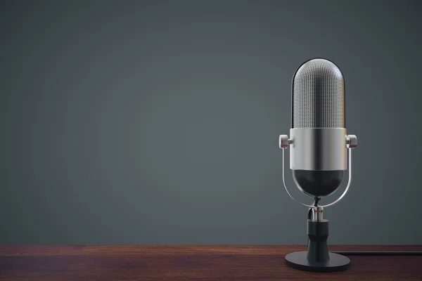 Mic on wooden table — Stock Photo, Image