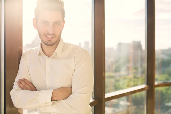 Businessman against window — Stock Photo, Image