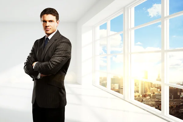 Confident businessman in interior — Stock Photo, Image