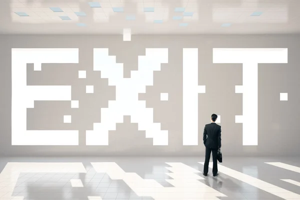 Pixeled exit text and businessman — Stock Photo, Image